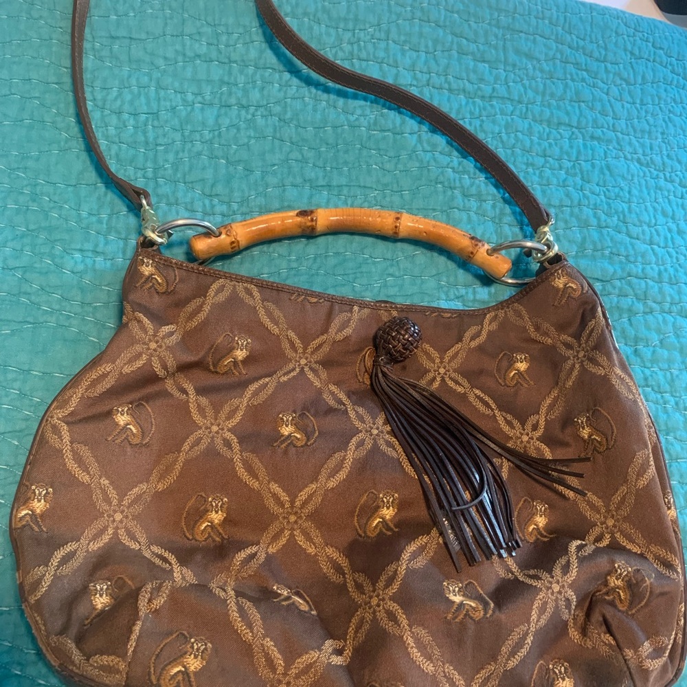 Tommy Bahama purse. 12 x 1 1/2 x 10. Suede interior with some use.
